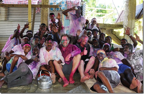 Covered in dye, celebrating Holi with our new friends, the traveling Hindu Holi band!