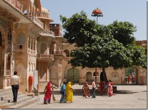Brightly colored pilgrims at Galtaji, near Jaipur, Rajasthan, India.  This place is also known as the "Monkey Temple" or Galwar Bagh.