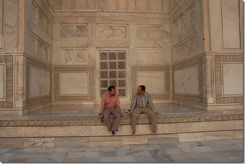 Relaxing and contemplating life on the warm white marble of the Taj Mahal in Agra, India