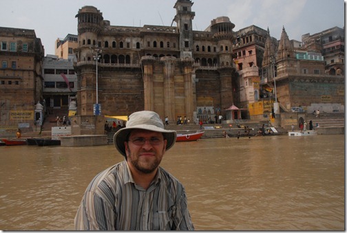 Taking a boat by the ghats along the Ganges River in Varanasi, India