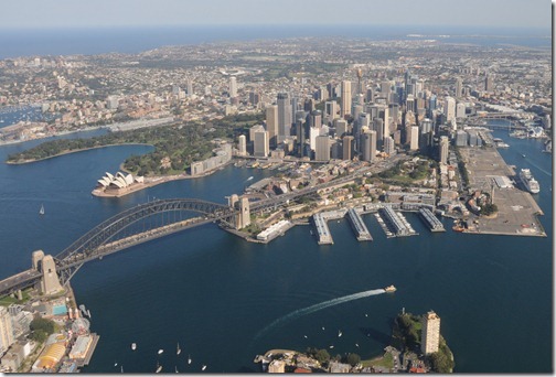 Aerial view of Sydney Harbour in Sydney, Australia showing the Sydney Harbour Bridge, the Opera House, and the Central Business District
