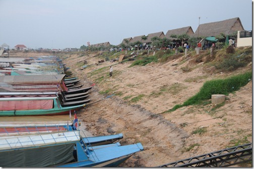 Boats tied to the Marina on Tonlé Sap lake. Note the huge drop from the current shore of the lake in dry season to where it ends up in monsoon season.