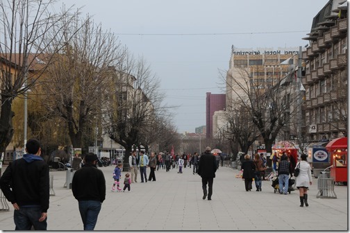Pedestrians on Mother Teresea Boulevard in Pristina, Kosovo