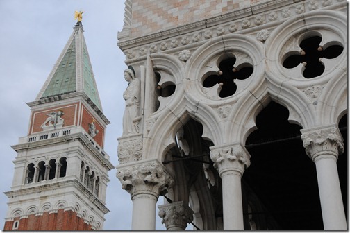 Detail of the Doge's Palace with the Campanile di San Marco (St. Mark's bell tower) in the background
