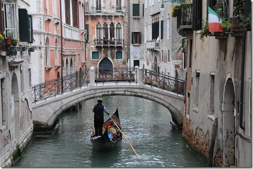 Gondola navigating the canals of Venice, Italy