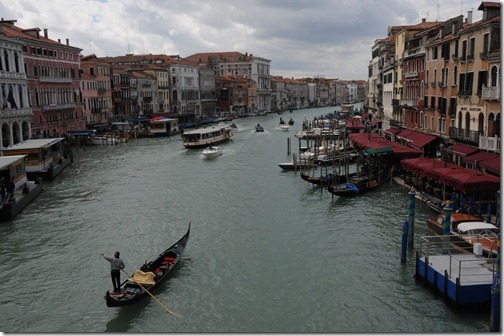 View of a Gondola in the Grand Canal from the Rialto Bridge in Venice, Italy
