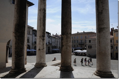 View through the columns Temple of Augustus in Pula, a Roman religious temple, one of the few remaining in the world - In Pula, Istria, Croatia
