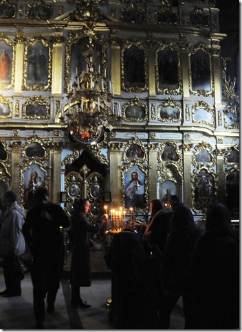 Pilgrims lighting candles inside the Kiev Pechersk Lavra (Києво-Печерська лавра), or the Monastery of the Caves, in Kiev, Ukraine