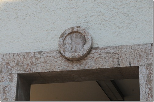 Wreath of the Hoheitszeichen (Hoheitsabzeichen,) the Nazi symbol, on a doorway of the train station in Berchtesgaden, Germany