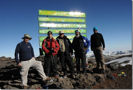 The Sharing the Point crew of (left to right) Joel Oleson, Eric Harlan, Michael Noel, Mark Miller, and Paul Swider at Uhuru Peak, Mount Kilimanjaro