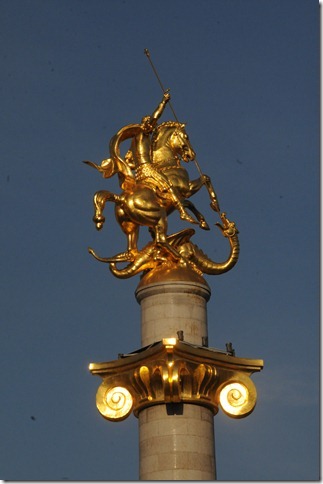 Freedom Monument (თავისუფლების მონუმენტი,) depicting St. George slaying the dragon, in Freedom Square (თავისუფლების მოედანი,) Tbilisi, Georgia