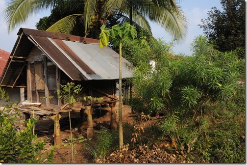 Village house supported by B-52 bomb casings in Ban Houayxay (Huay Xai), Laos