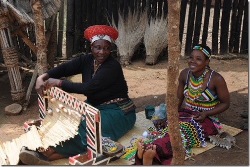 Actresses making traditional clothing inside Shakaland, South Africa